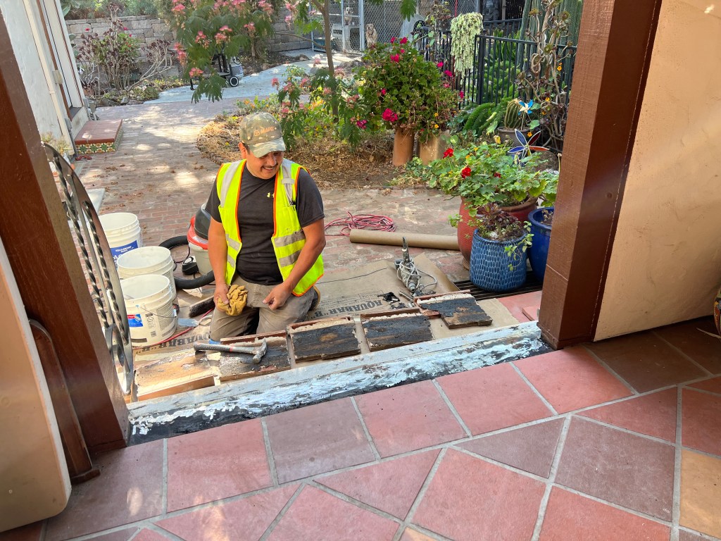 Resetting porch tiles, July 2022