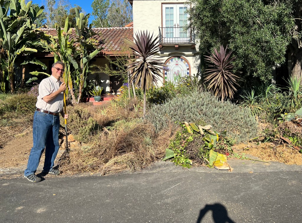 John Plocher raking weeds, July 2022