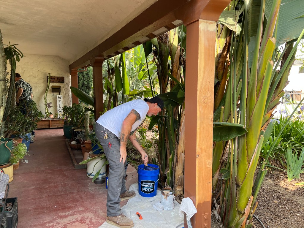 Painting new porch post, July 2022